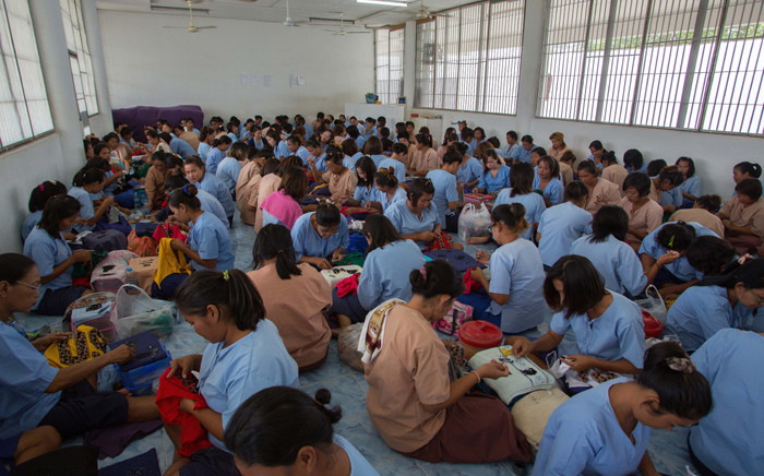 Thai female inmates at a sewing workshop at a prison in Ayutthaya north of Bangkok. Lured by easy money, an escape from poverty or family pressure, thousands of women are locked up for drug offences in Thailand, which has one of the worlds highest rates of female imprisonment. Picture: AFP.