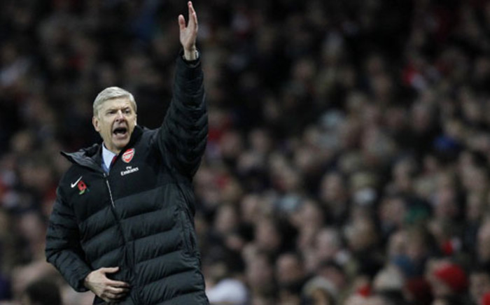 An Arsenal shareholder says coach Arsene Wenger lacks support from the board. Picture: AFP.
