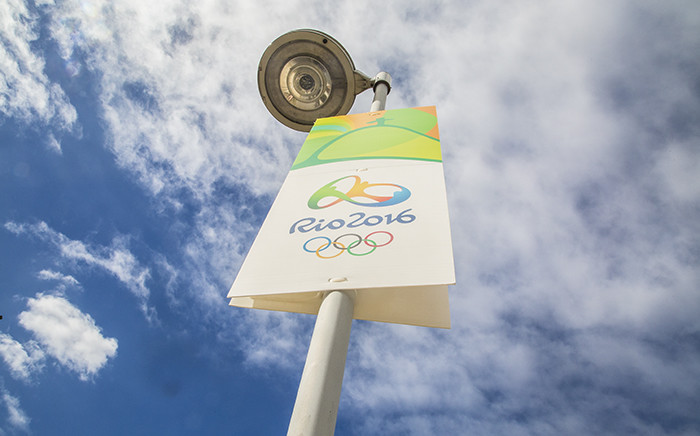 A poster promoting the Rio 2016 Olympic Games hangs from a streetlight on the streets of Rio de Janeiro. Picture: Reinart Toerien/EWN.
