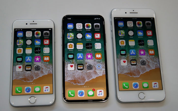 FILE: (L-R) The new iPhone 8, iPhone X and iPhone 8S are displayed during an Apple special event at the Steve Jobs Theatre on the Apple Park campus on September 12, 2017 in Cupertino, California. Picture: AFP