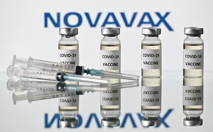 This file illustration picture shows vials with COVID-19 Vaccine stickers attached and syringes with the logo of US biotech company Novavax, on 17 November 2020. Europe's medicines watchdog on 20 December 2021, approved a COVID jab by US-based Novavax, which uses a more conventional technology that the biotech firm hopes will reduce vaccine hesitancy. Picture: Justin Tallis/AFP