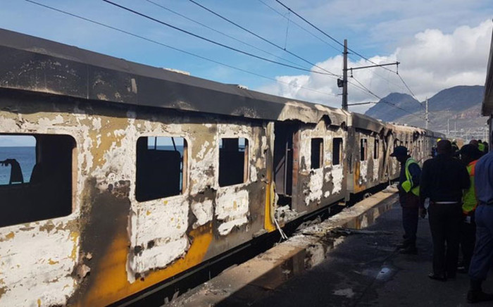 Officials assess the damage of a train fire at Glencairn station on 7 October 2019. Picture: 1 Second Alerts