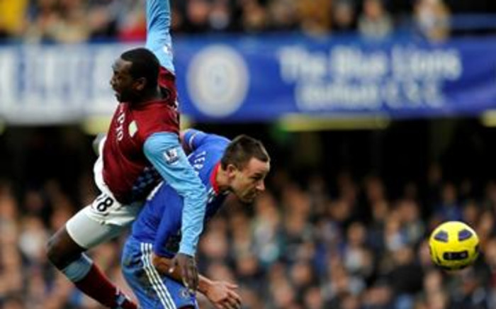 Aston Villa's English striker Emile Heskey (L) vies with Chelsea's English defender John Terry (R) during their English Premier League football match. Picture: 
