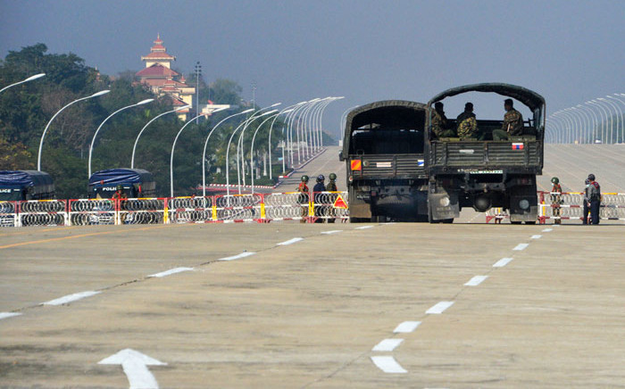 Soldiers stand guard along a blockaded road near Myanmar's Parliament in Naypyidaw on 2 February 2021, as Myanmar's generals appeared in firm control a day after a surgical coup that saw democracy heroine Aung San Suu Kyi detained. Picture: AFP