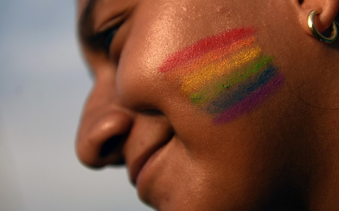 A member of the Lesbian, Gay, Bisexual, Transgender, Transvestite, Transgender and Intersex (LGBTTTI) communities participates in a march against homophobia on 21 May 2016 in San Salvador. Picture: AFP.