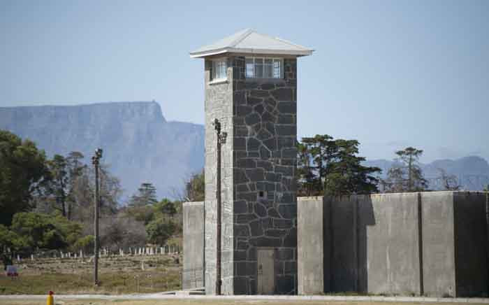 FILE: A view of a guard tower and Table Mountain behind some of the former prison buildings on Robben Island. Picture: RODGER BOSCH/AFP