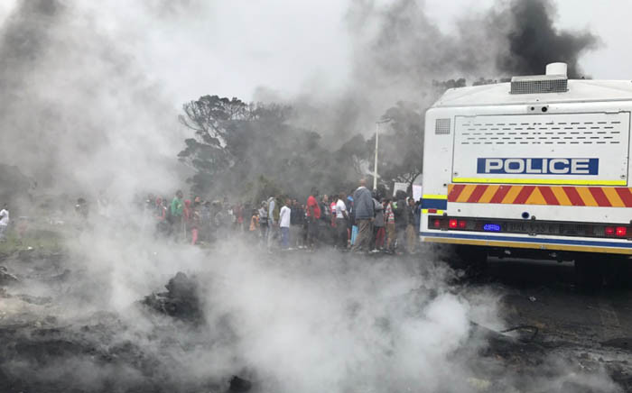 FILE: A group of Ocean View protesters are seen next to a police van during a demonstration against gang violence. Picture: Kevin Brandt/EWN