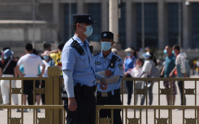 Police officers keep watch in Tiananmen Square in Beijing on 4 June 2021, the 32nd anniversary of the deadly 1989 crackdown on pro-democracy protests. Picture: Greg Baker/AFP