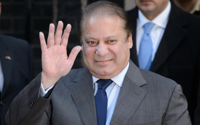 Pakistan's Prime Minister Nawaz Sharif waves to the media after a meeting at number 10 Downing Street in central London on 5 December, 2014. Picture: AFP.