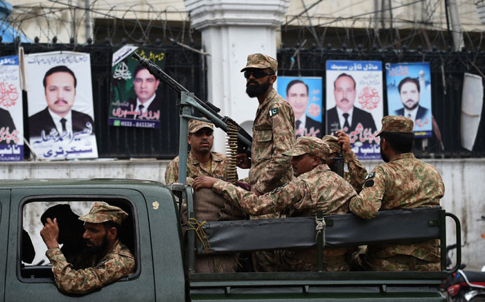 Pakistani soldiers patrol outside a voting material distribution centre in Lahore on 24 July, 2018. Pakistan will hold its general election on 25 July. Picture: AFP