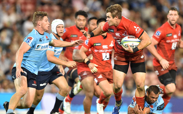 Sunwolves player Gerhard Van Den Heever (3rd R) is tackled by Waratahs player Michael Hooper (L) and Kurtley Beale (bottom, 2nd R) during the Super Rugby match between Australia's Waratahs and Japan's Sunwolves in Newcastle on 29 March 2019. Picture: AFP