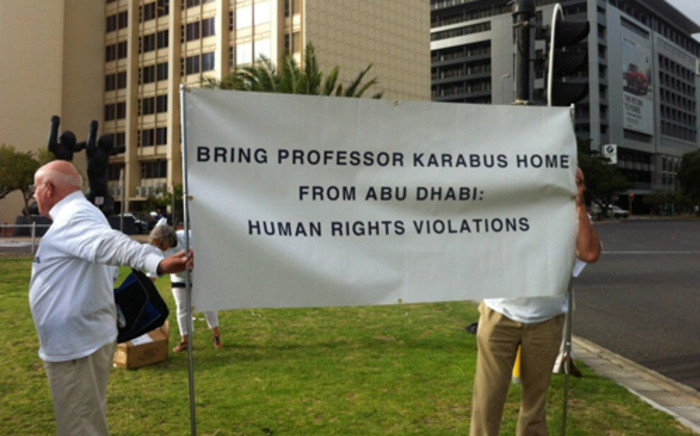 Supporters of Doctor Cyril Karabus, who faces manslaughter charges in the UAE, picketed outside the CTICC on 18 February 2013. Picture: Carmel Loggenberg/EWN