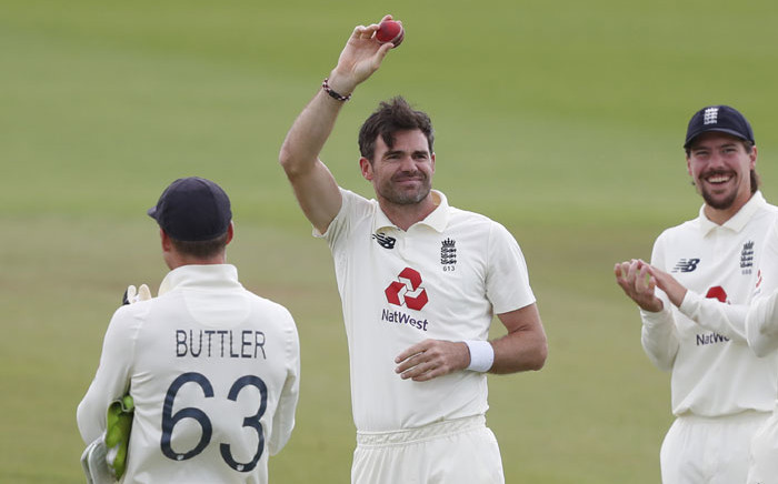 England's James Anderson (C) shows the ball as he is applauded by teammates after taking the wicket of Pakistan's Azhar Ali, his 600th test match wicket, on the fifth day of the third Test cricket match between England and Pakistan at the Ageas Bowl in Southampton, southern England on 25 August 2020. Picture: AFP