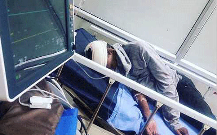 Top SA runner Thabang Mosiako pictured in hospital following an attack. Picture: facebook.com