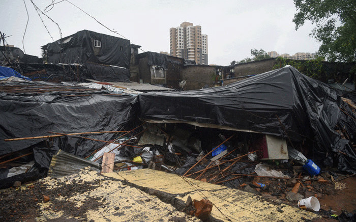 A general view shows shanty homes after a wall collapsed on them early morning in Mumbai on 2 July 2019. At least 15 people were killed in India's financial capital of Mumbai early on 2 July when a wall collapsed during torrential monsoon downpours. Picture: AFP