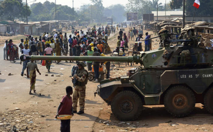 French troops of the Sangaris Operation take position in the PK12 district of Bangui on 16 January 2014. At least seven people were killed in overnight violence in Bangui. Picture: AFP.