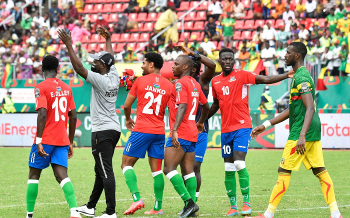 Gambia's midfielder Musa Barrow (2R) celebrates with teammates at the end of the Group F Africa Cup of Nations (CAN) 2021 football match between Gambia and Mali at Limbe Omnisport Stadium in Limbe on January 16, 2022.  Picture: Issouf SANOGO / AFP