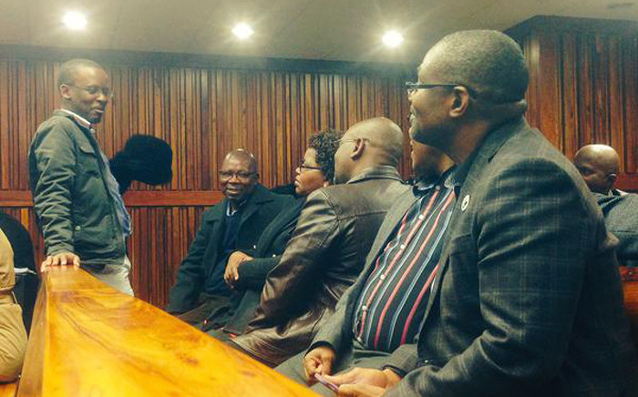 National Union of Metalworkers of South Africa and Cosatu members sit inside Johannesburg High Court ahead of the court hearing after Numsa made calls to be reinstated back to Cosatu on 9 June 2015. Picture: Govan Whittles/EWN.