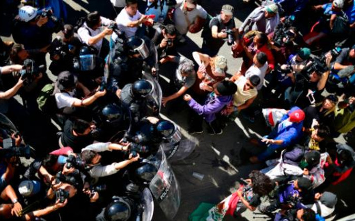 A screengrab of migrants in Mexico trying to rush through the US border. Picture: CNN