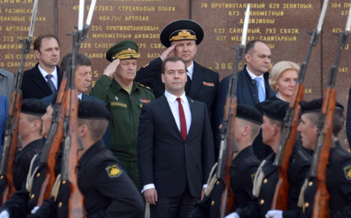 Russia’s Prime Minister Dmitry Medvedev (back C) watches Russian troops parading as he takes part in a wreath laying ceremony at a Memorial the 1941-1942 Heroic Defence of Sevastopol during the World War II in Sevastopol, 31 March, 2014. Picture: AFP.