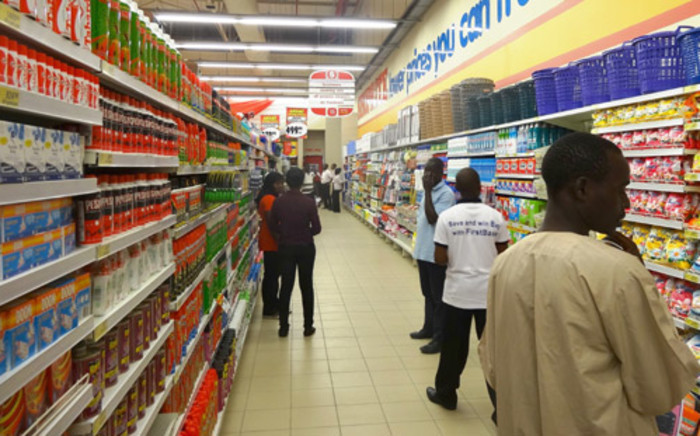 A file photo shows shoppers at the new South African retail giant Shoprite. Picture: AFP.