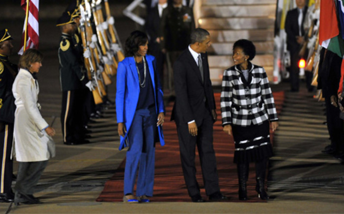 US President Barack Obama and his wife Michelle are received by Minister of International Relations and Cooperation Maite Nkoana-Mashabane after landing at the Waterkloof Airforce Base in Pretoria on Friday evening, 28 June 2013. Picture: GCIS/SAPA