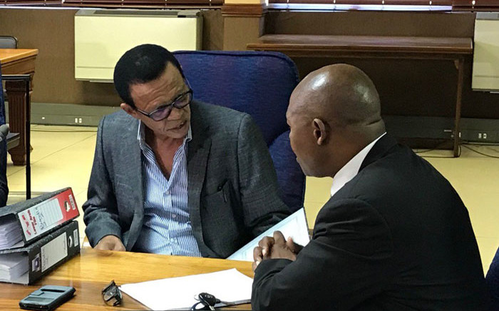 FILE: Advocate Lawrence Mrwebi (left) speaks to his legal counsel during the Mokgoro Inquiry into his fitness to hold office on 21 January 2019. Picture: EWN