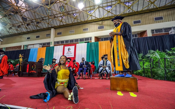 Nbuhle Myeni does a split on stage at her graduation ceremony held at the University of KwaZulu-Natal (UKZN) Westville campus on 11 May 2022. Picture: : Abhi Indrarajan/Supplied.

