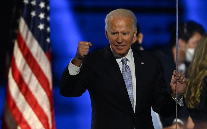 FILE: US President-elect Joe Biden holds up his fist after delivering remarks in Wilmington, Delaware, on 7 November 2020, after being declared the winners of the presidential election. Picture: AFP