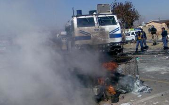 Police try to quell violence in Soweto during a service delivery protest