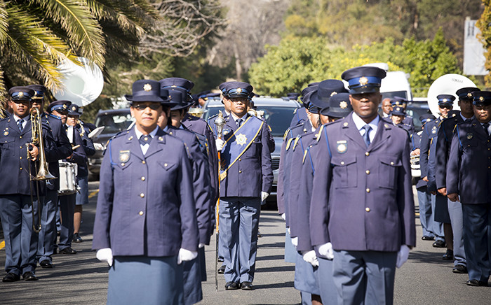 FILE: Police honour guard march outside the Dutch Reformed Church in Somerset West after Warrant Officer Holz's funeral. Picture: Thomas Holder/EWN