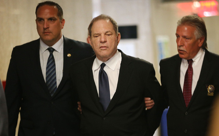 FILE: Harvey Weinstein is escorted in handcuffs into the State Supreme Court after on Monday for arraignment on charges alleging he committed a sex crime against a third woman on 9 July 2018 in New York City. Picture: AFP