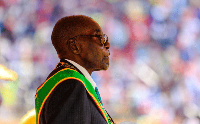 FILE: This file photo taken on 18 April 2017 shows Zimbabwe's former president, Robert Mugabe, reviewing the guard of honour during the country's 37th Independence Day celebrations at the National Sports Stadium in Harare. Picture: AFP