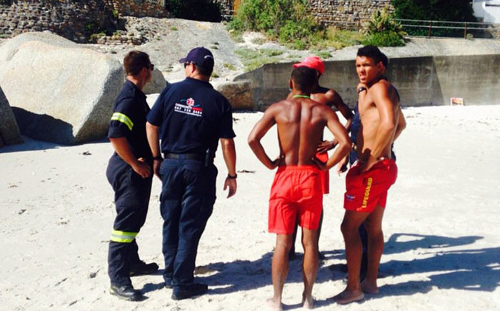 Authorities are on Glen beach in Camps Bay after a body was reportedly seen floating. Picture: Shamiela Fisher/EWN.