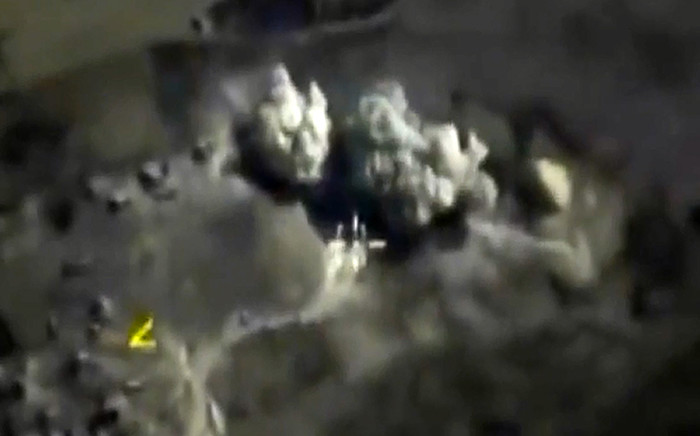 A video grab made on 3 October, 2015, shows an image taken from a footage made available on the Russian Defence Ministrys official website, purporting to show an explosion after airstrikes carried out by Russian air force on what Russia says was an underground explosives warehouse in Raqqa. Picture: AFP.
