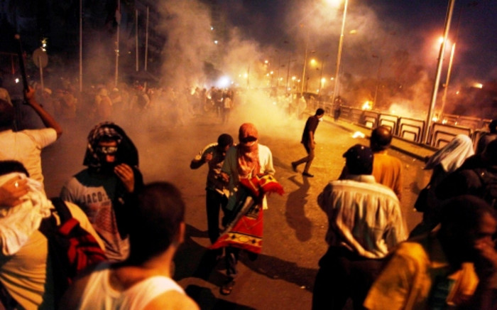 Egyptian supporters of the Muslim Brotherhood rallying in support of deposed president Mohamed Morsi clash with police outside the elite Republican Guards base in Cairo early on July 8, 2013.  Picture: AFP /Mahmoud Khaled