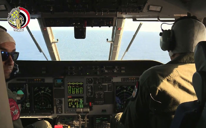 An image grab taken from a handout video released by the Egyptian Defence Ministry on 20 May, 2016 shows Egyptian military pilots taking part in a search mission over the Mediterranean Sea for the remains of an EgyptAir plane which crashed on 19 May, 2016 with 66 people on board, as mystery surrounded its fate despite suspicions of terrorism. Picture: AFP.
