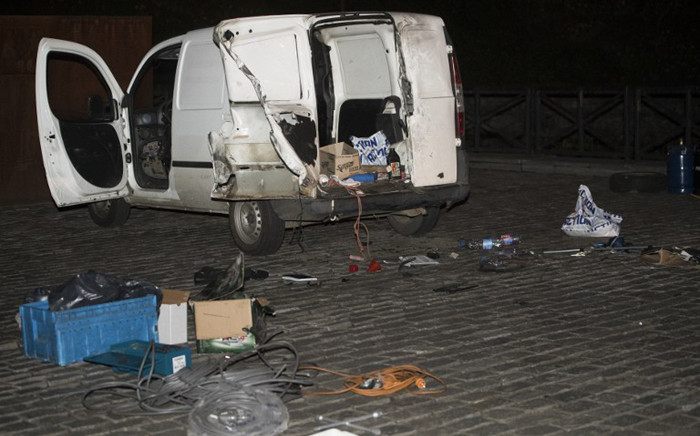 This photo taken on 2 March, 2017 in Brussels shows the remnants of a car after an explosive disposal robot unit examined the automobile, after police stopped the driver, known by authorities for radicalism, for initially failing to stop at a traffic light and subsequently discovering two gas cylinders within the rear of the vehicle. Picture: AFP.