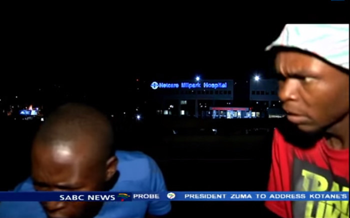 A screengrab shows two men that robbed the SABC news crew while preparing to go live on air outside Milpark Hospital on 10 March 2015