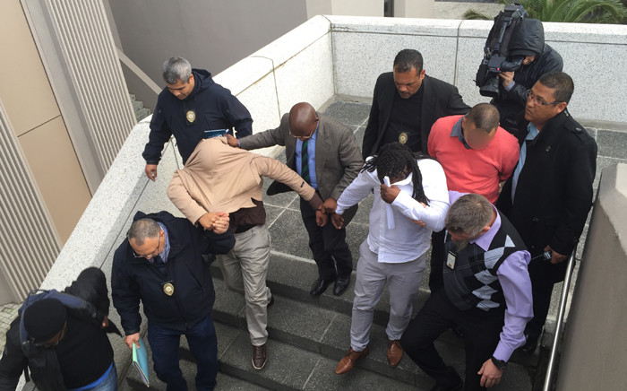 FILE: Three City of Cape Town traffic officials are marched out of the Civic Centre after they were arrested for fraud and corruption on 13 July 2015. Picture: Natalie Malgas/EWN.
