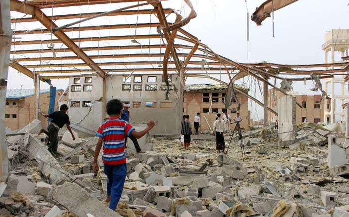 Yemenis inspect the damage caused by a Saudi-led air strike on a cholera treatment centre supported by Doctors Without Borders (MSF) in the Abs region of Yemen on 11 June 2018. Picture: AFP.