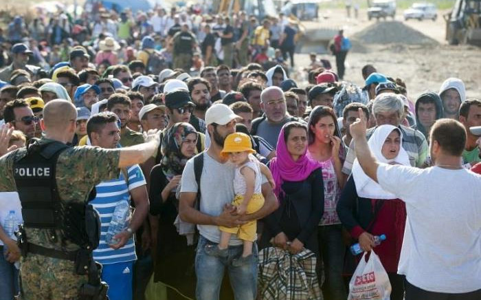 Migrants wait at the new reception center near the town of Gevgelija, on the Macedonian-Greek border on August 23, 2015. Picture: AFP.