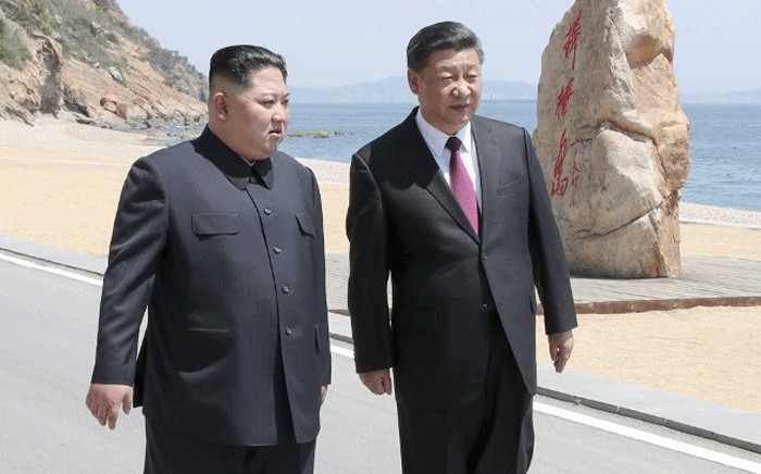 This photo released on 8 May 2018 by China's Xinhua News Agency shows North Korean leader Kim Jong Un meeting with Chinese President Xi Jinping in Dalian, in northeast China's Liaoning province. Picture: AFP.