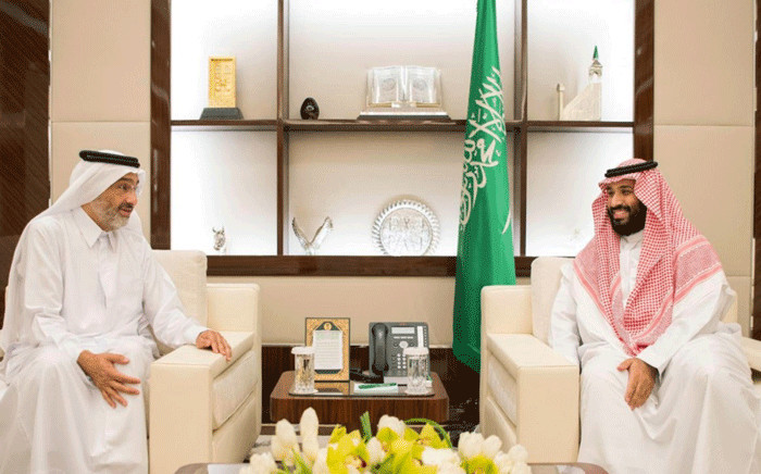 A handout picture provided by the Saudi Press Agency (SPA) shows Saudi Crown Prince Mohammed bin Salman (R) meeting with Qatari envoy Sheikh Abdullah bin Ali bin Jassim al-Thani in Jeddah on 16 August 2017. King Salman has ordered the reopening of the border with Qatar to hajj pilgrims. Picture: AFP.