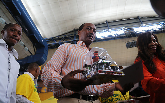South African mining magnate Patrice Motsepe hands out christmas presents to underprivileged children in Soweto south of Johannesburg on 14 December 2015. Picture: Reinart Toerien/EWN.