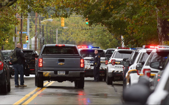Police members respond to the site of a mass shooting at the Tree of Life Synagogue in the Squirrel Hill neighbourhood on 27 October 2018 in Pittsburgh, Pennsylvania. Picture: AFP.