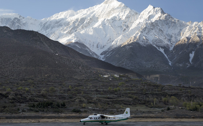 A picture made available on 24 February 2016 shows a twin aircraft of the Tara Airlines landing at Jomsom Airport, in Jomsom, a popular resort town west of Kathmandu, Nepal, 4 April 2015, as Mount Nilgiri is visible on the background. Picture: EPA/Narendra Shrestha.