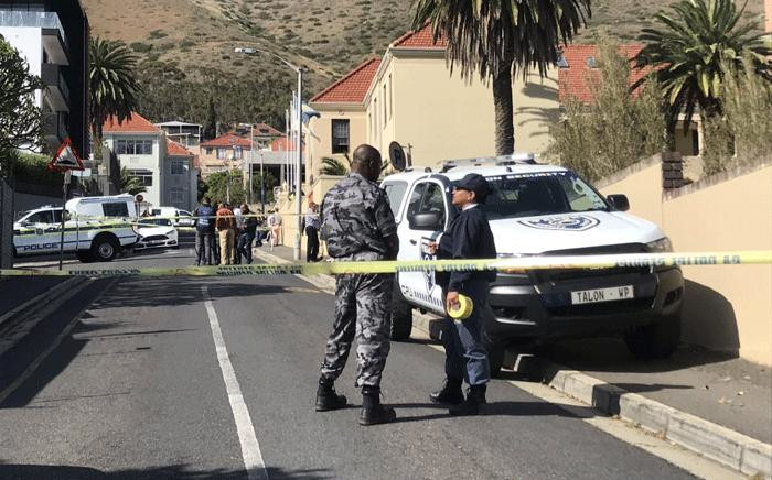 Police and forensic experts comb the scene of a shooting after prominent advocate Pete Mihalik was gunned down outside a Cape Town school on 30 October 2018. Picture: Kaylynn Palm/EWN