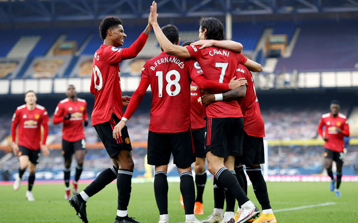 FILE: Manchester United striker Edinson Cavani celebrates scoring his team's third goal with teammates during the English Premier League football match between Everton and Manchester United at Goodison Park in Liverpool, north-west England on 7 November 2020. Picture: AFP