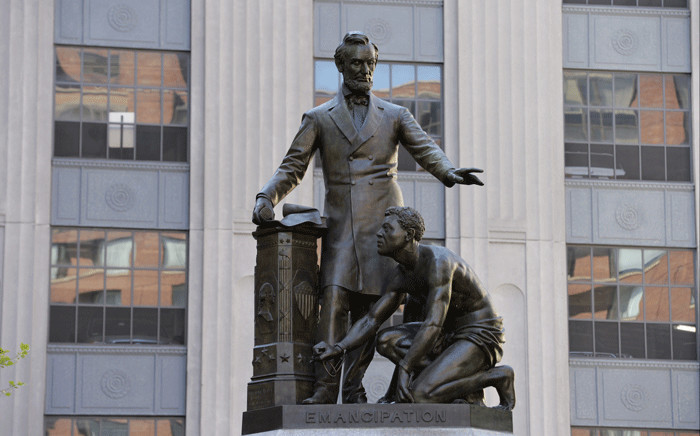 The Abraham Lincoln Statue, erected in 1879, by Thomas Ball, is viewed in Park Square in Boston, Massachusetts on June 16, 2020. The statue is a copy of the “Emancipation Memorial” in Washington DC and represents Lincoln freeing African American slaves at the end of the US Civil War. Picture: AFP.